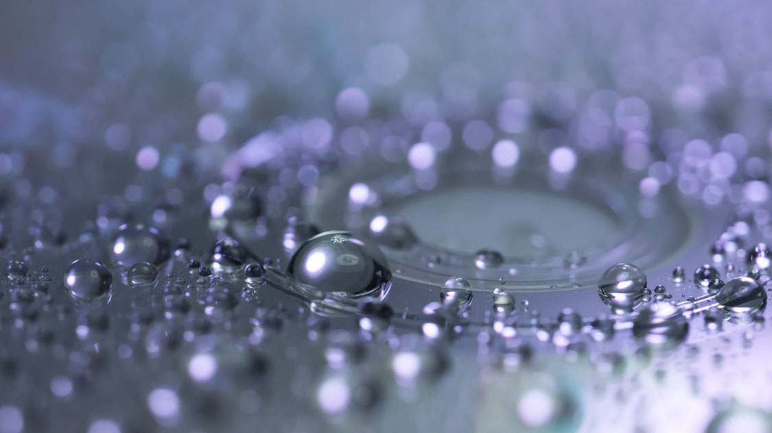 Ripple effect of purple raindrops