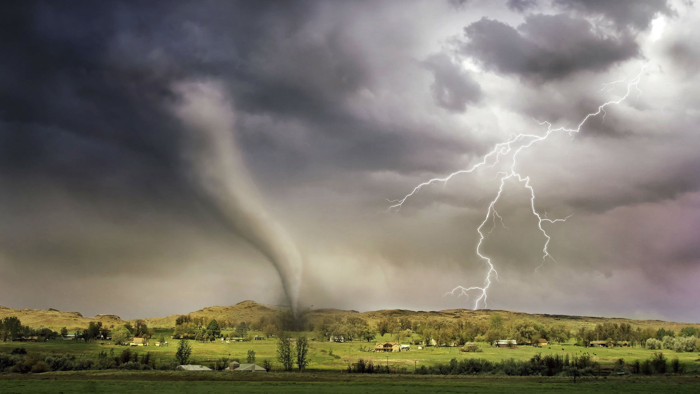 Tornado and lightning hitting a small village