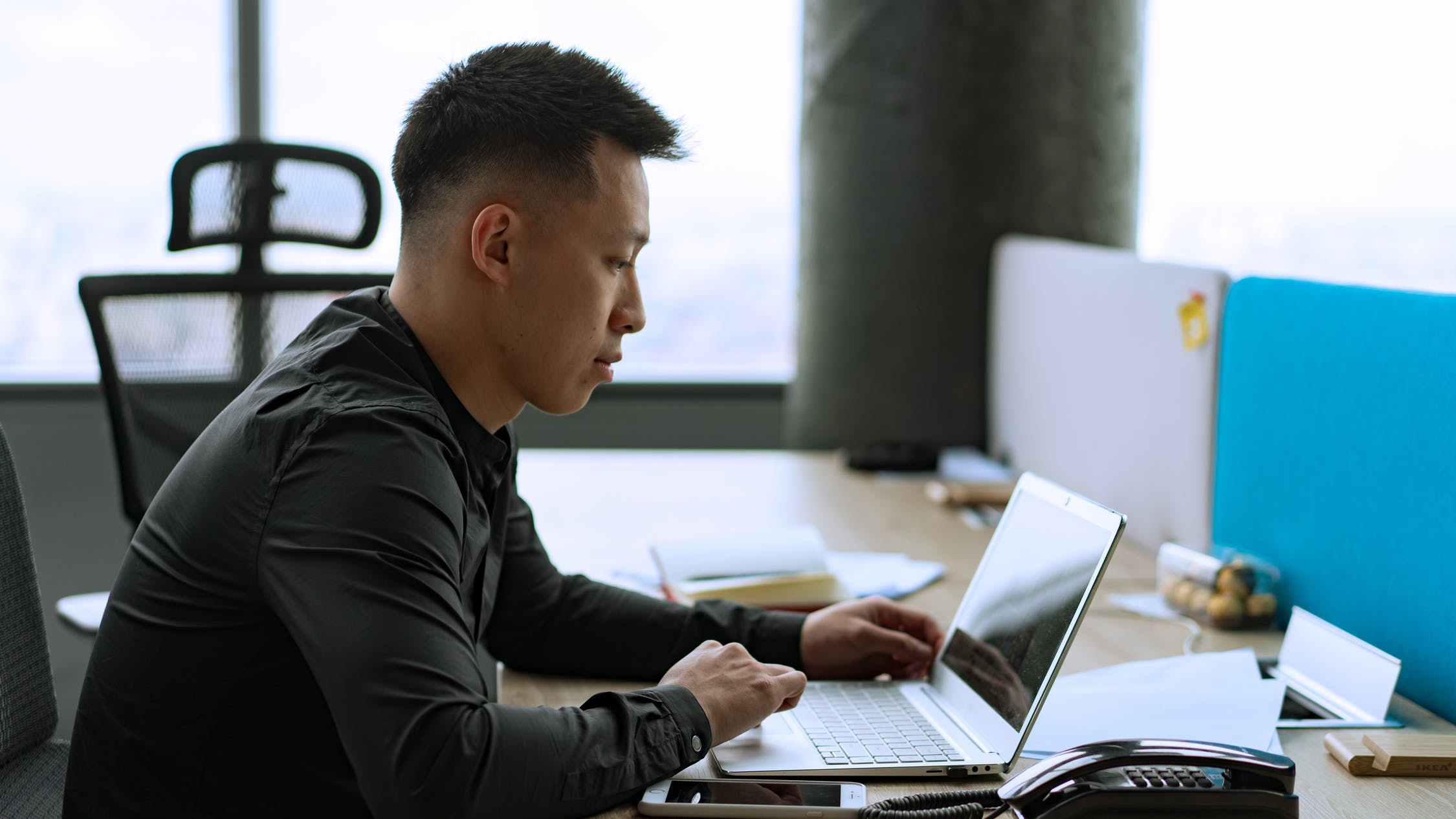 Person sitting at a desk with a computer