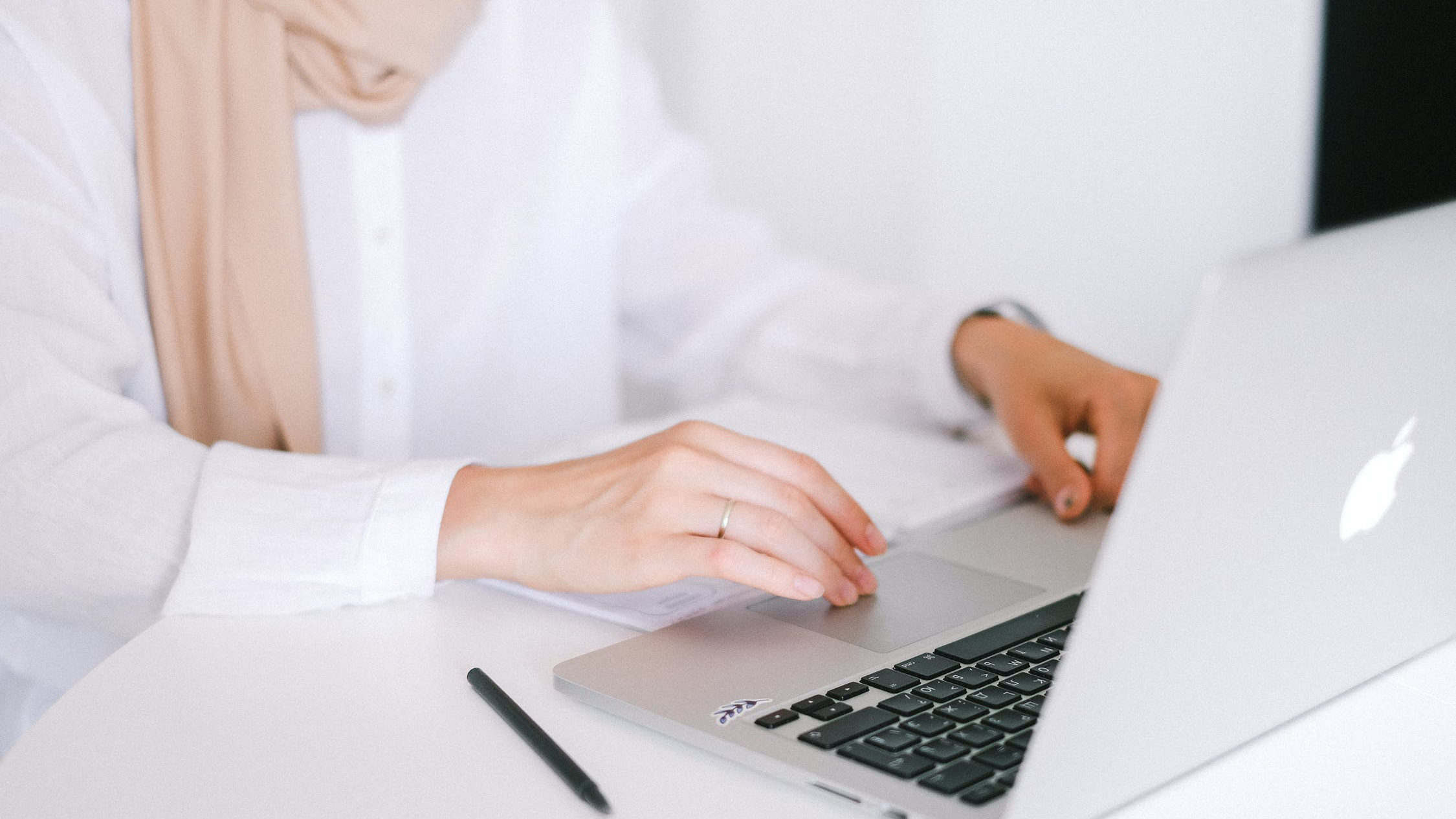 Woman working on laptop at a desk