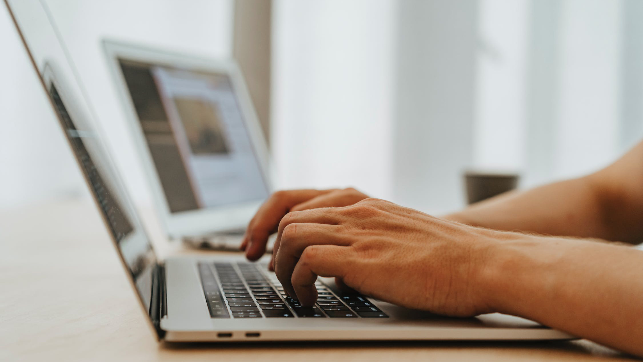 Person typing on a laptop