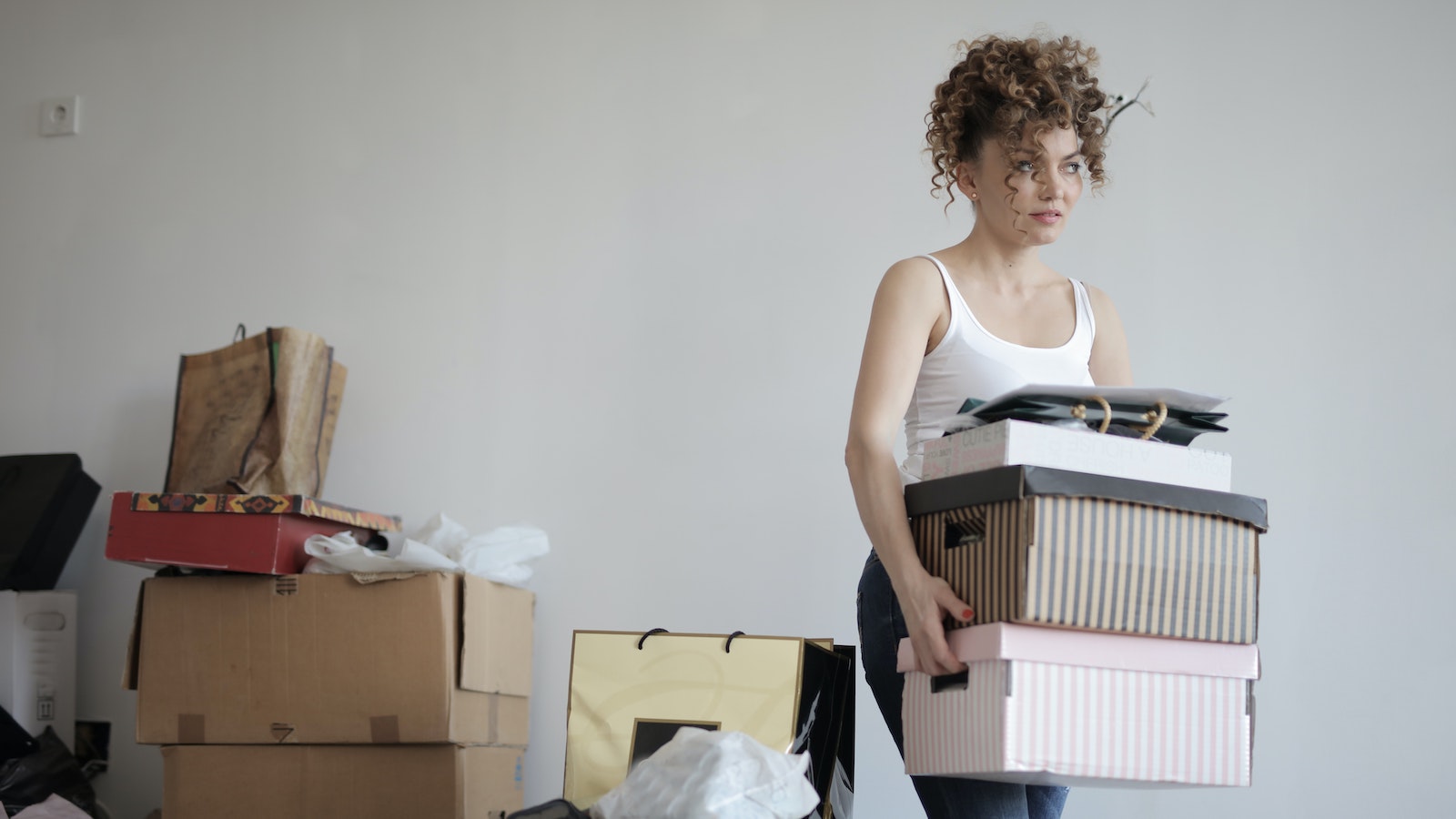 Woman carrying boxes