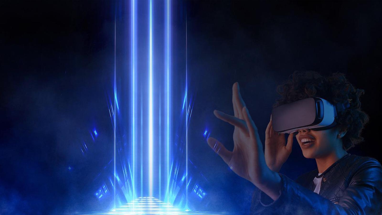 A woman wearing a VR headset holding out her hand to a blue beacon