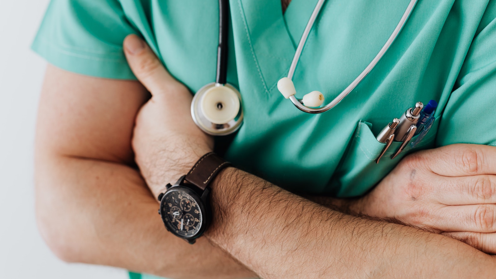 A doctor or nurse with arms crossed