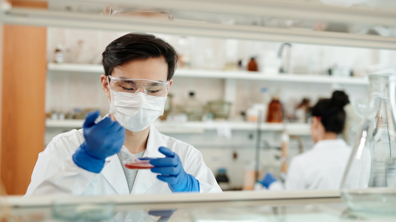 Scientist in gloves and lab coat