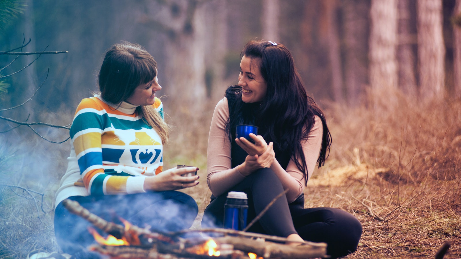 Two women in the woods having a conversation