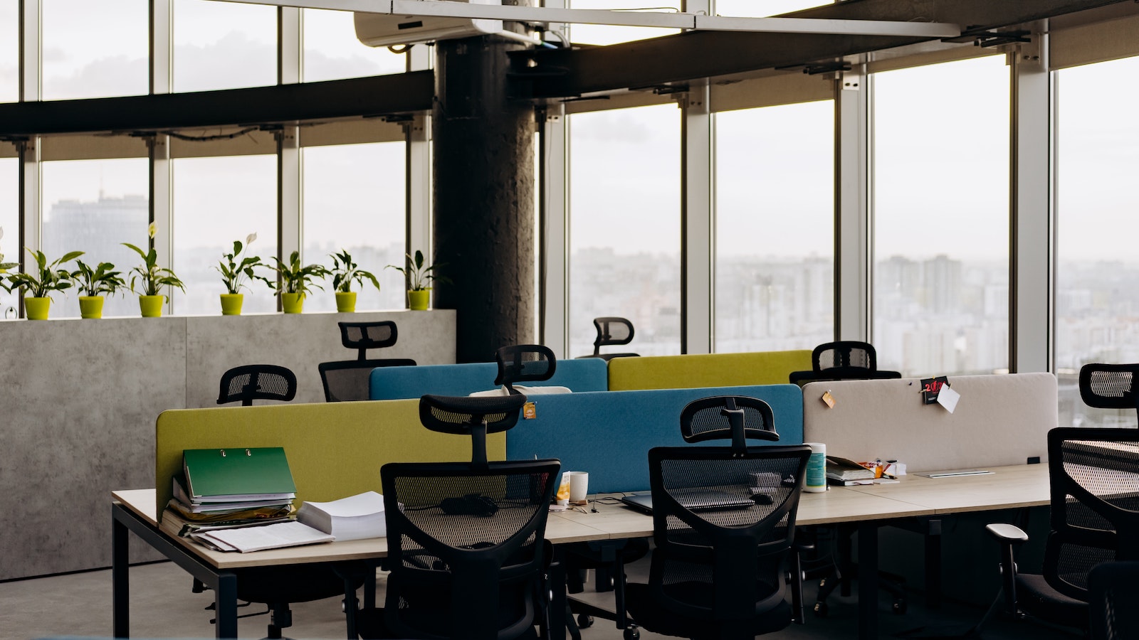 Desks with colorful dividers in a work space