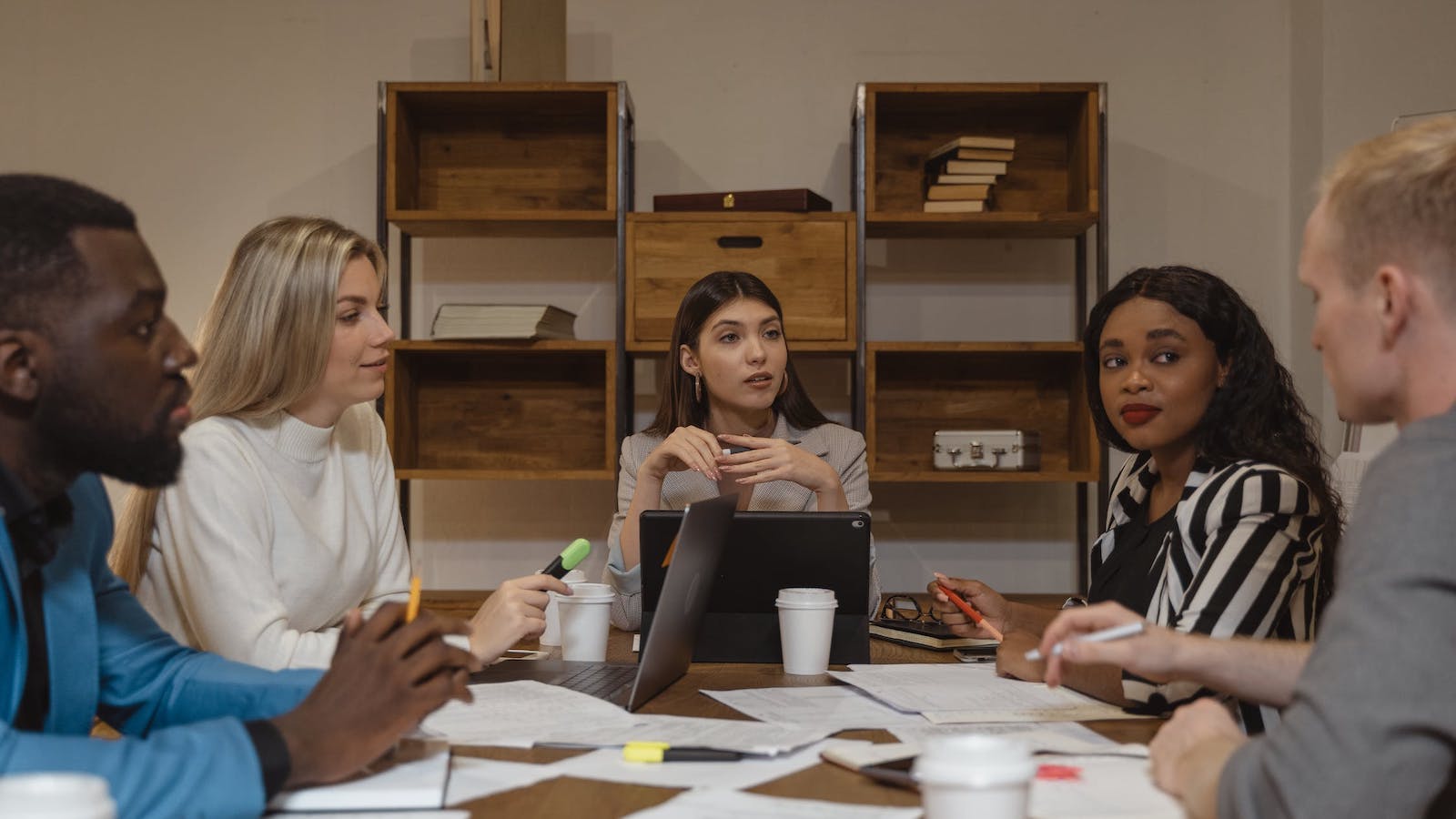 People talking around a work table