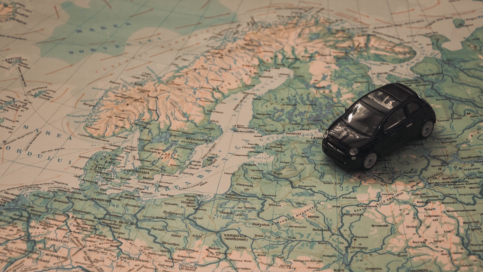 Toy car on map of Europe