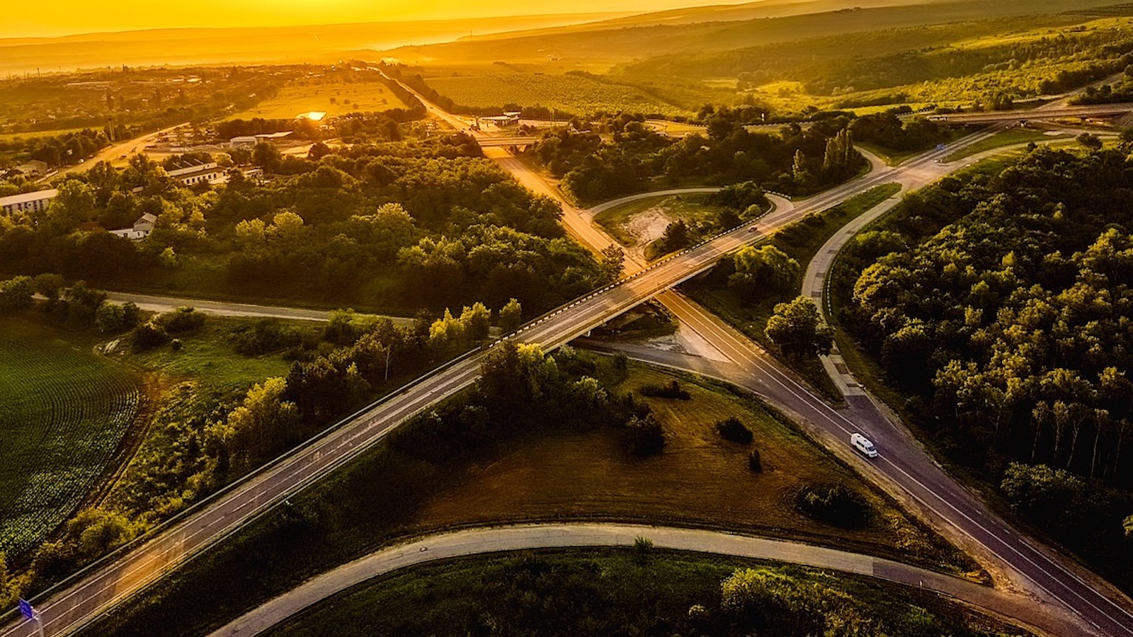 Overhead view of a freeway with on-ramps at sunset