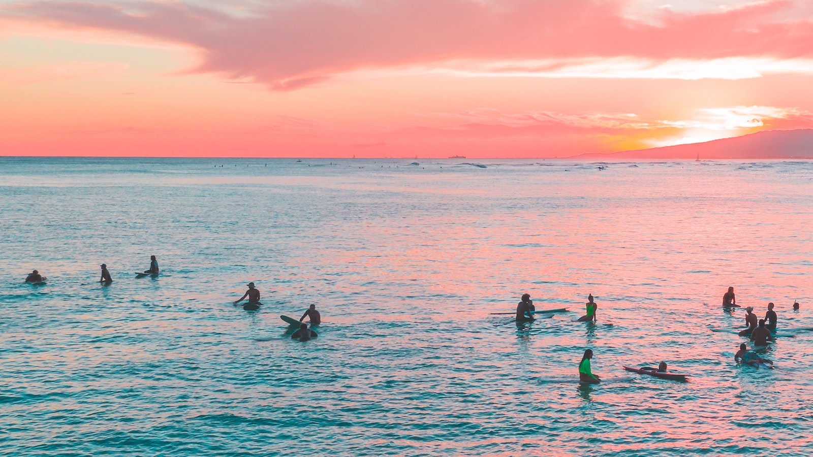 People swimming and wading in the ocean