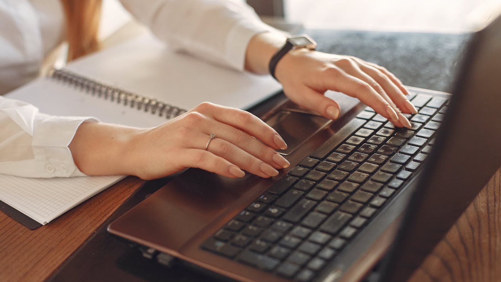 Person typing on a computer at a desk