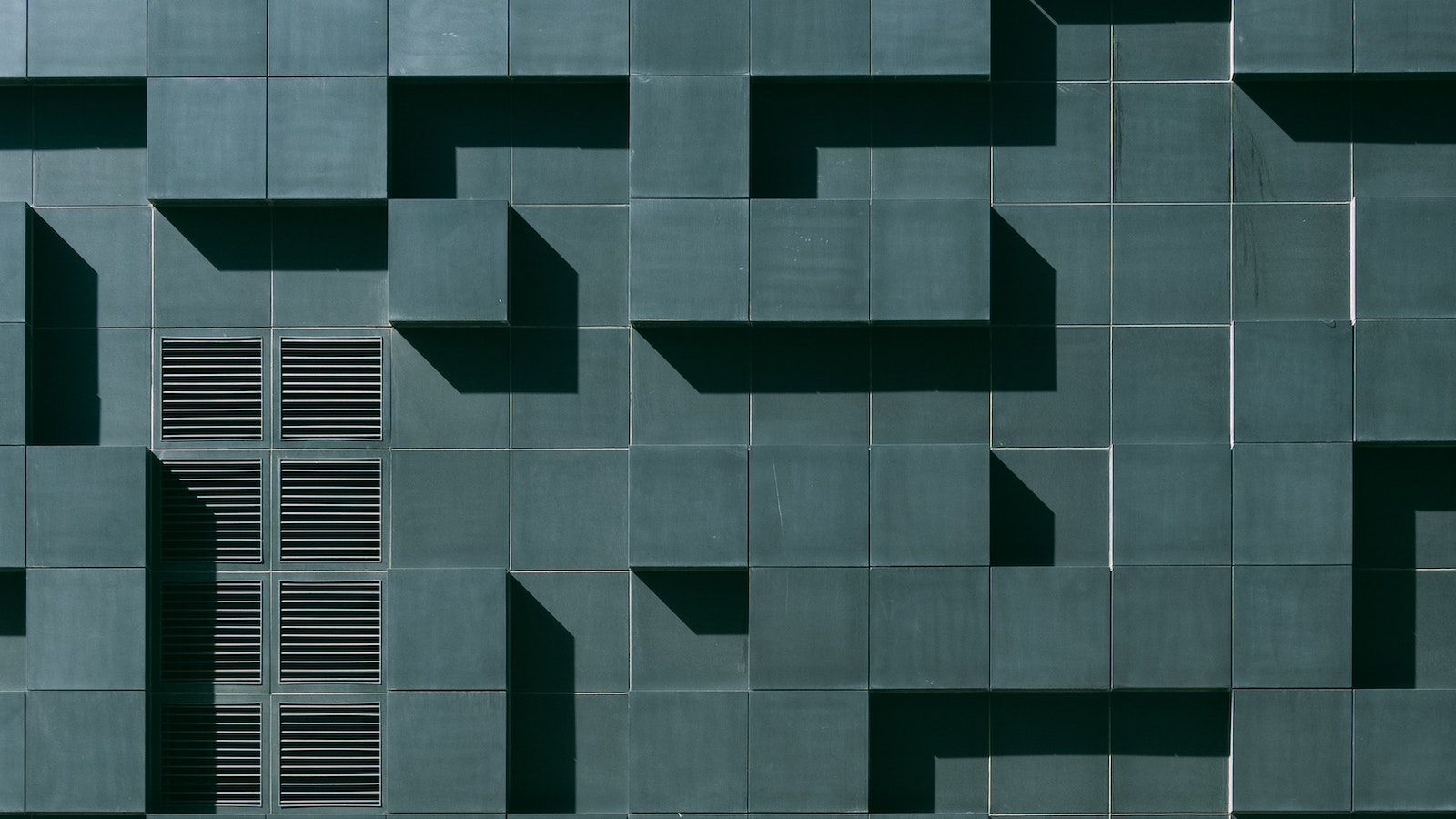 Blue-green wall in a grid pattern