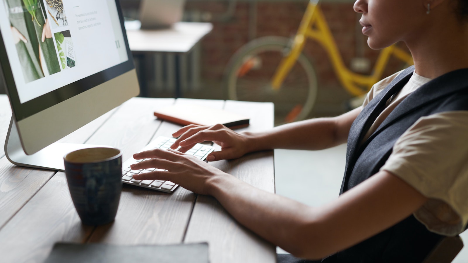 Person sitting at a desk on a computer