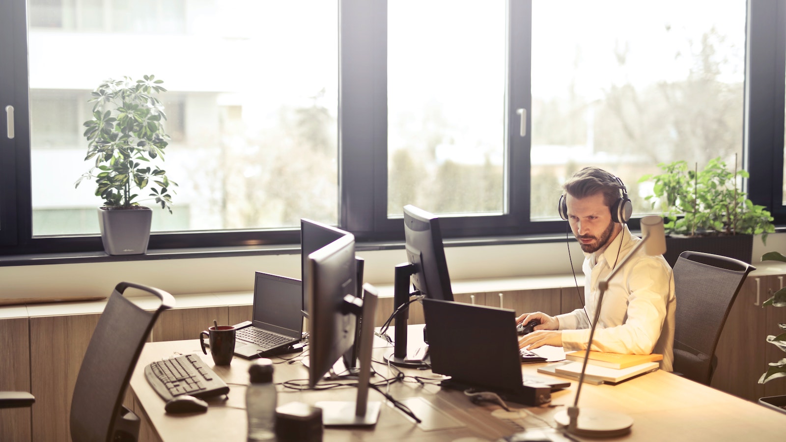 A man sitting at a desk on a computer