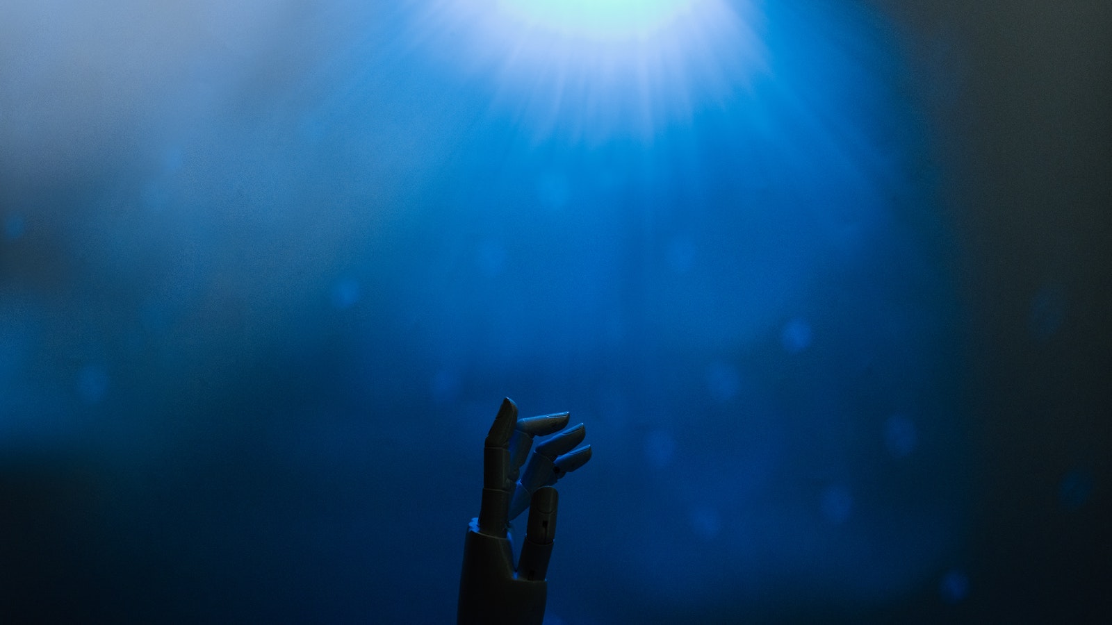 Robotic hand below blue light