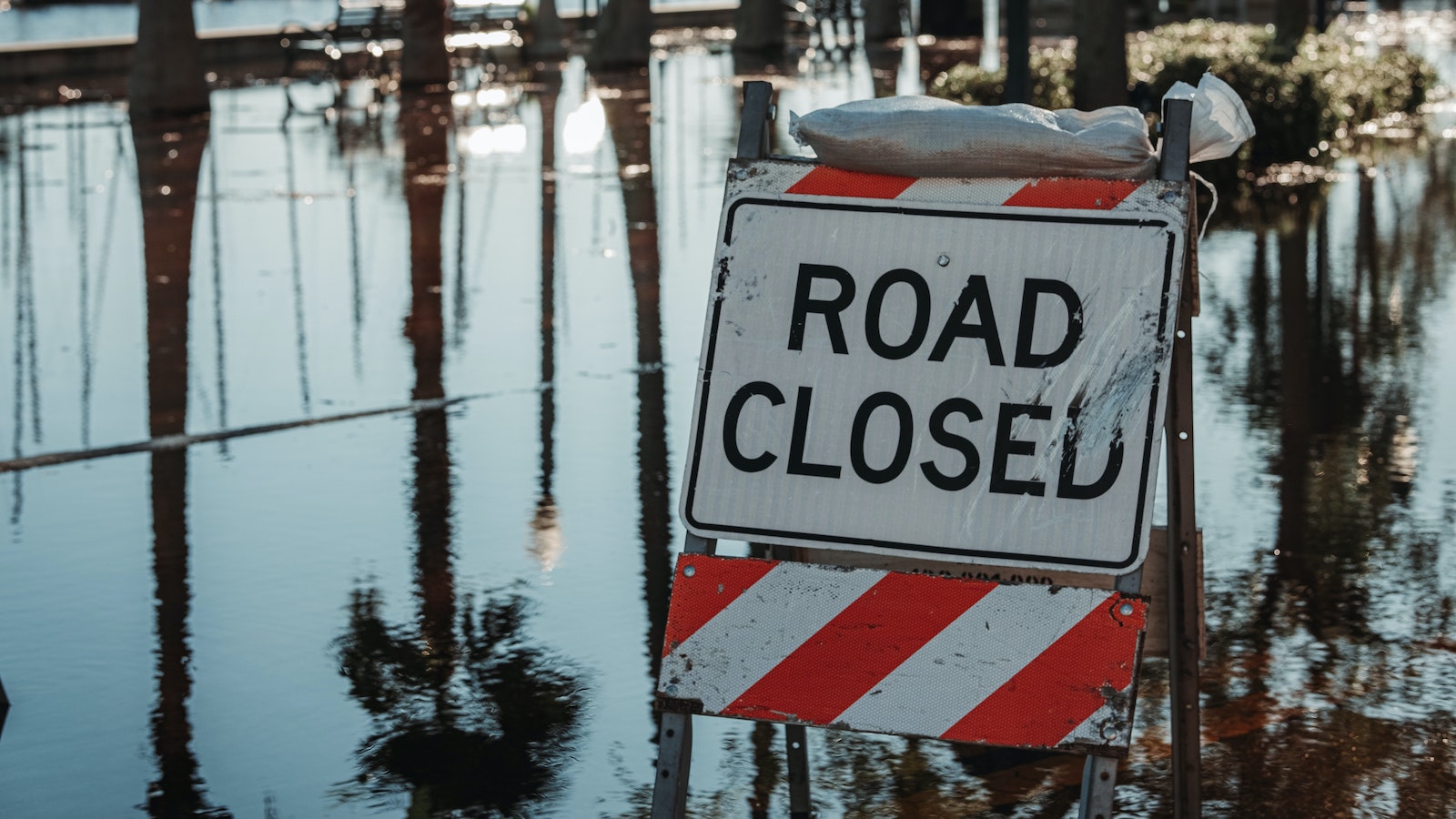 Road closed sign on a flooded road