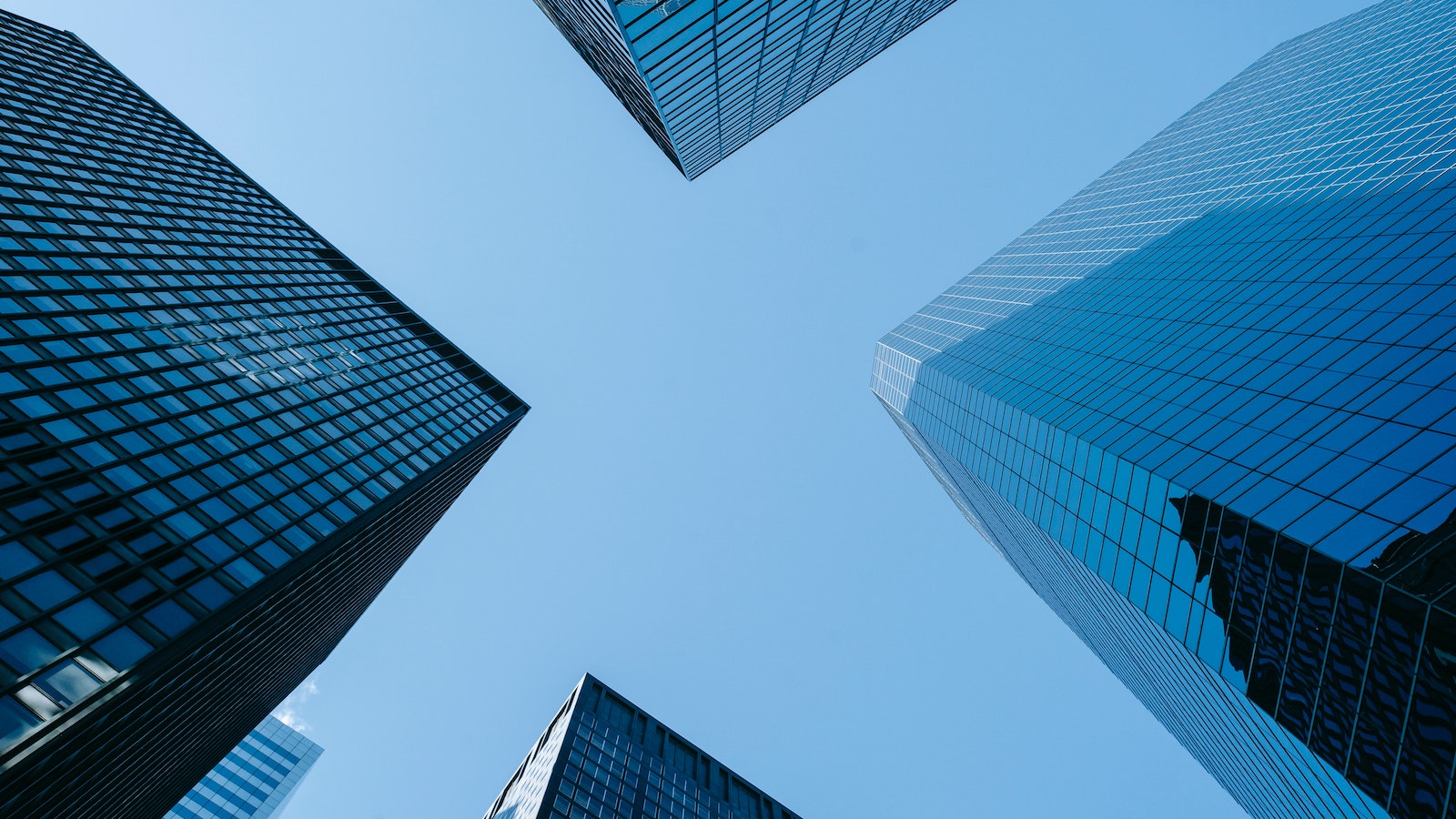 Four skyscrapers with the blue sky in between