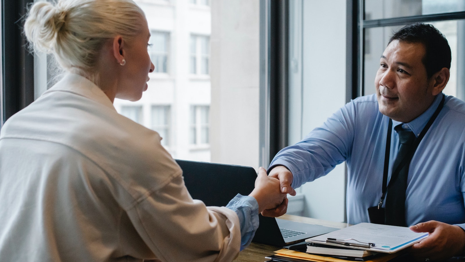 Person shaking hands with another person