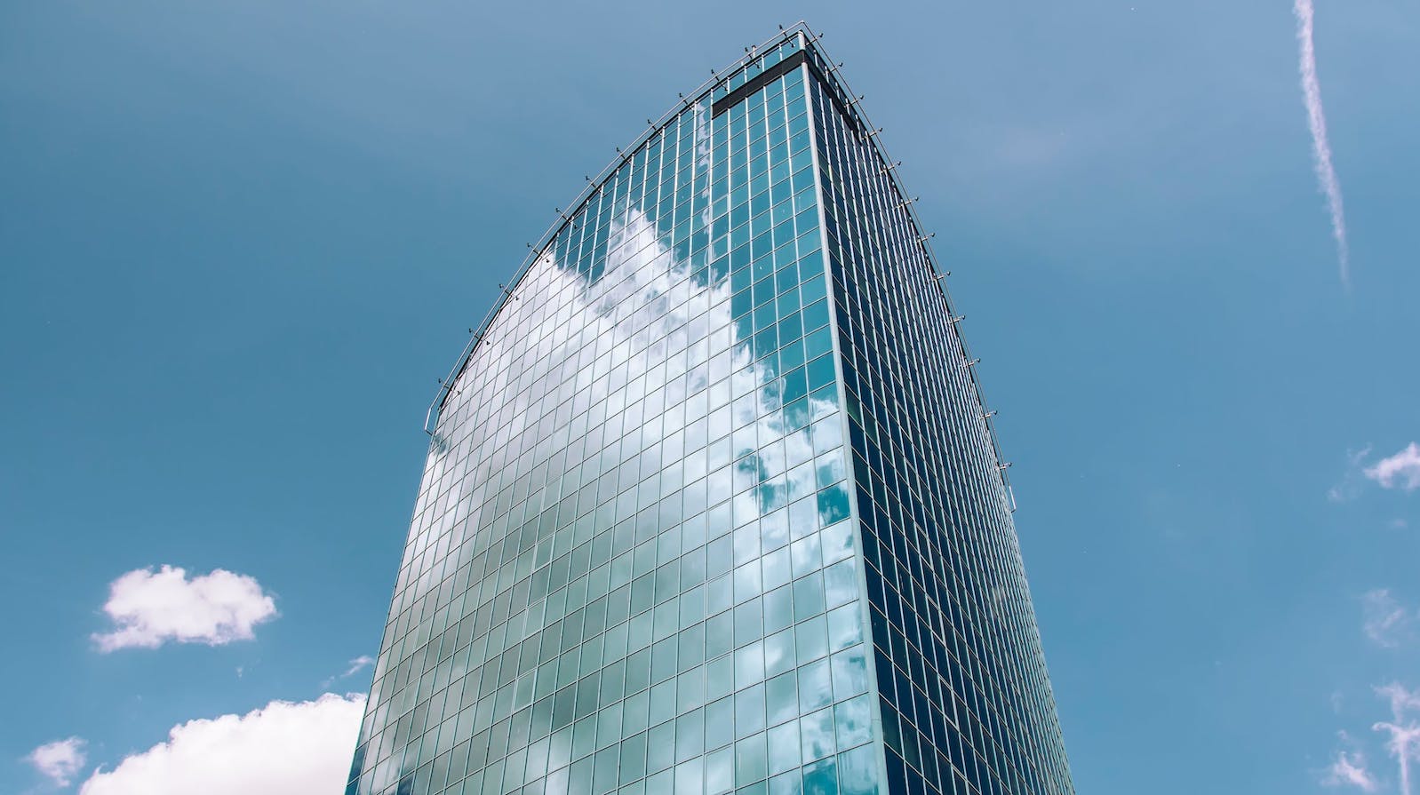 Office building against a blue sky with clouds