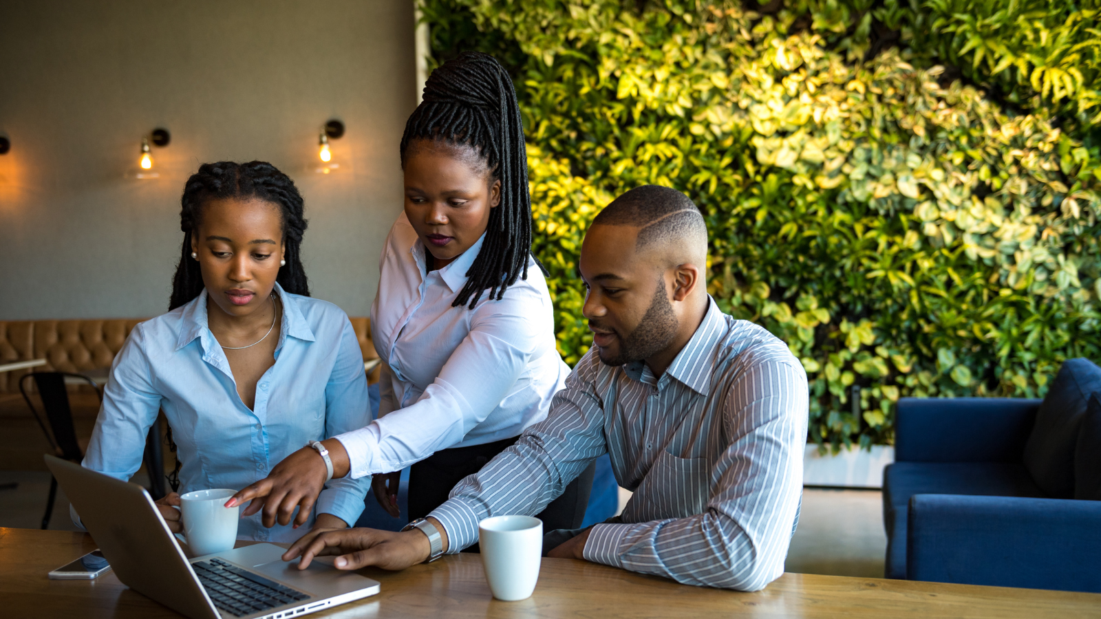 Group looking at laptop