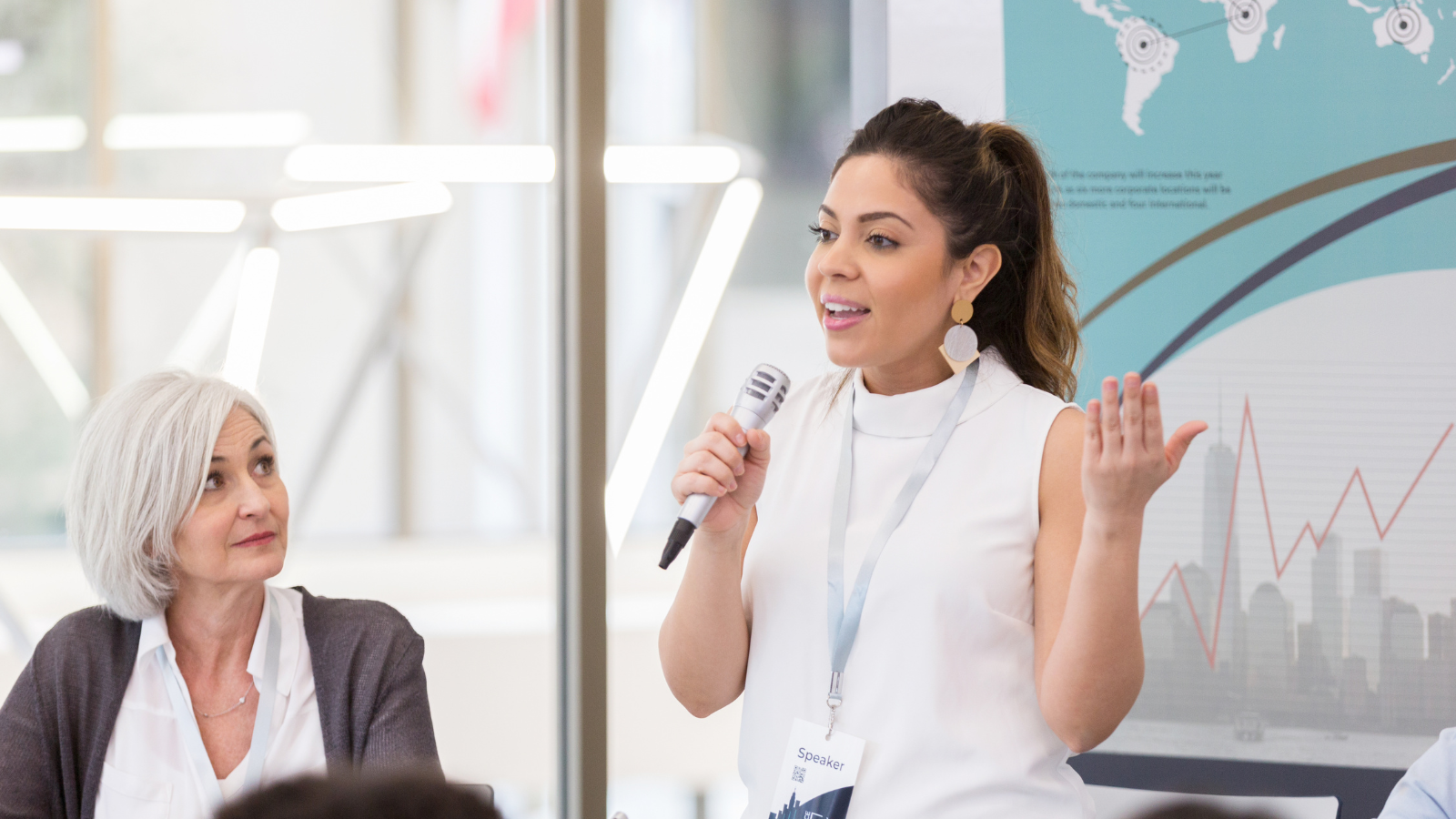 Woman speaking into a microphone