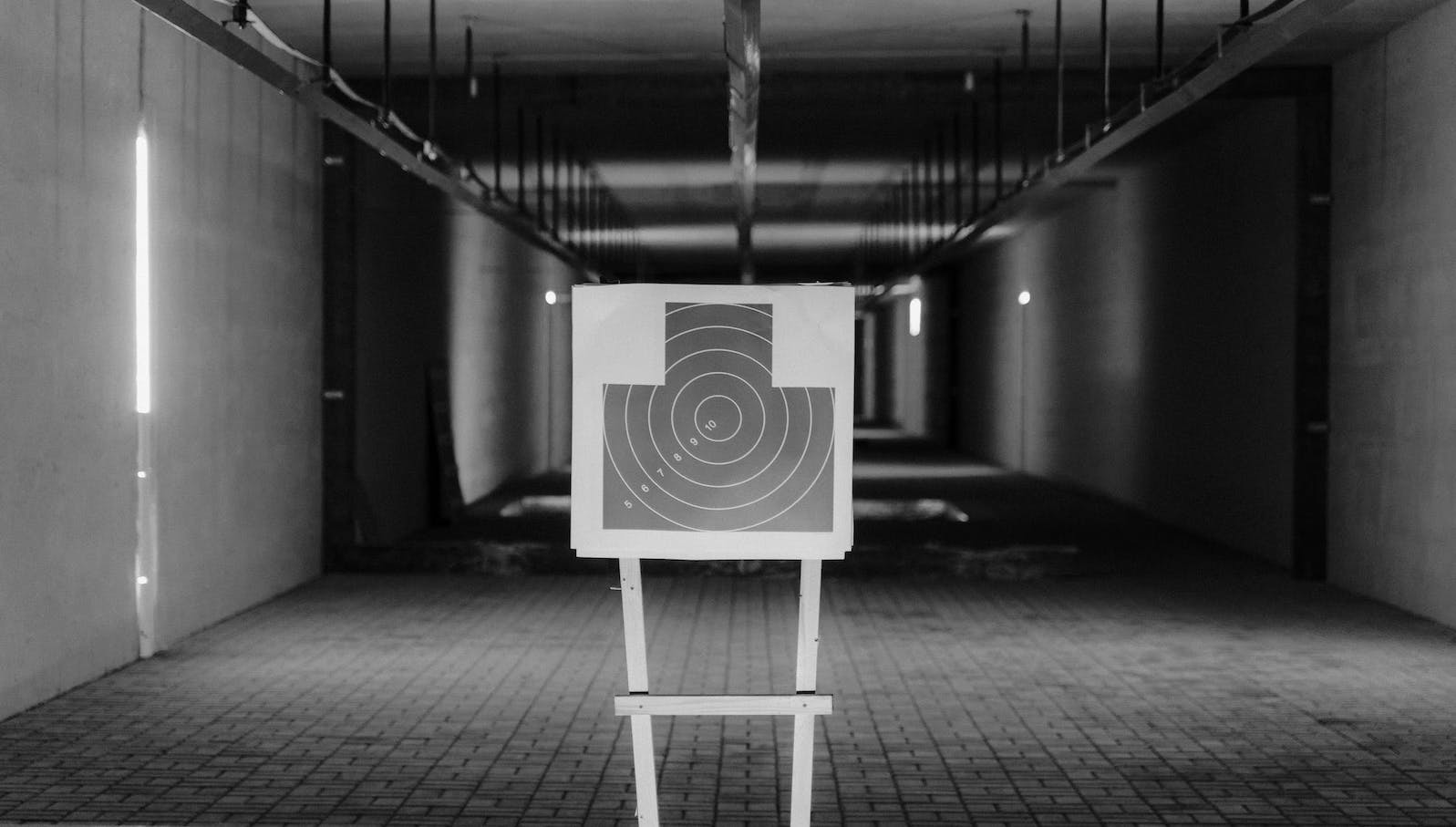 Grayscale Photo of Shooting Target Stand