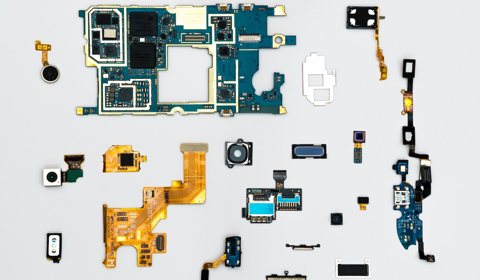 Blue and yellow separate computer parts against a gray background