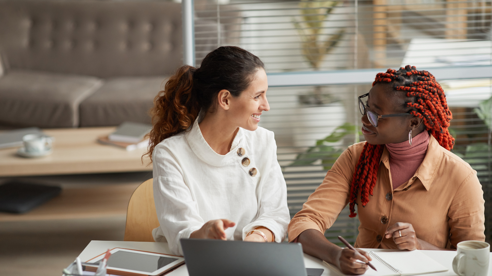 Two women talking at work