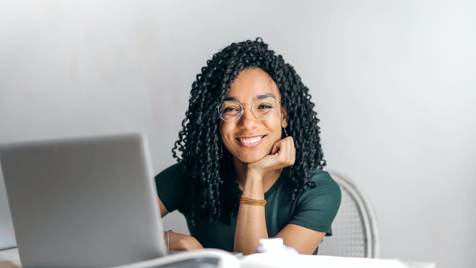 Woman sitting in front of a laptop