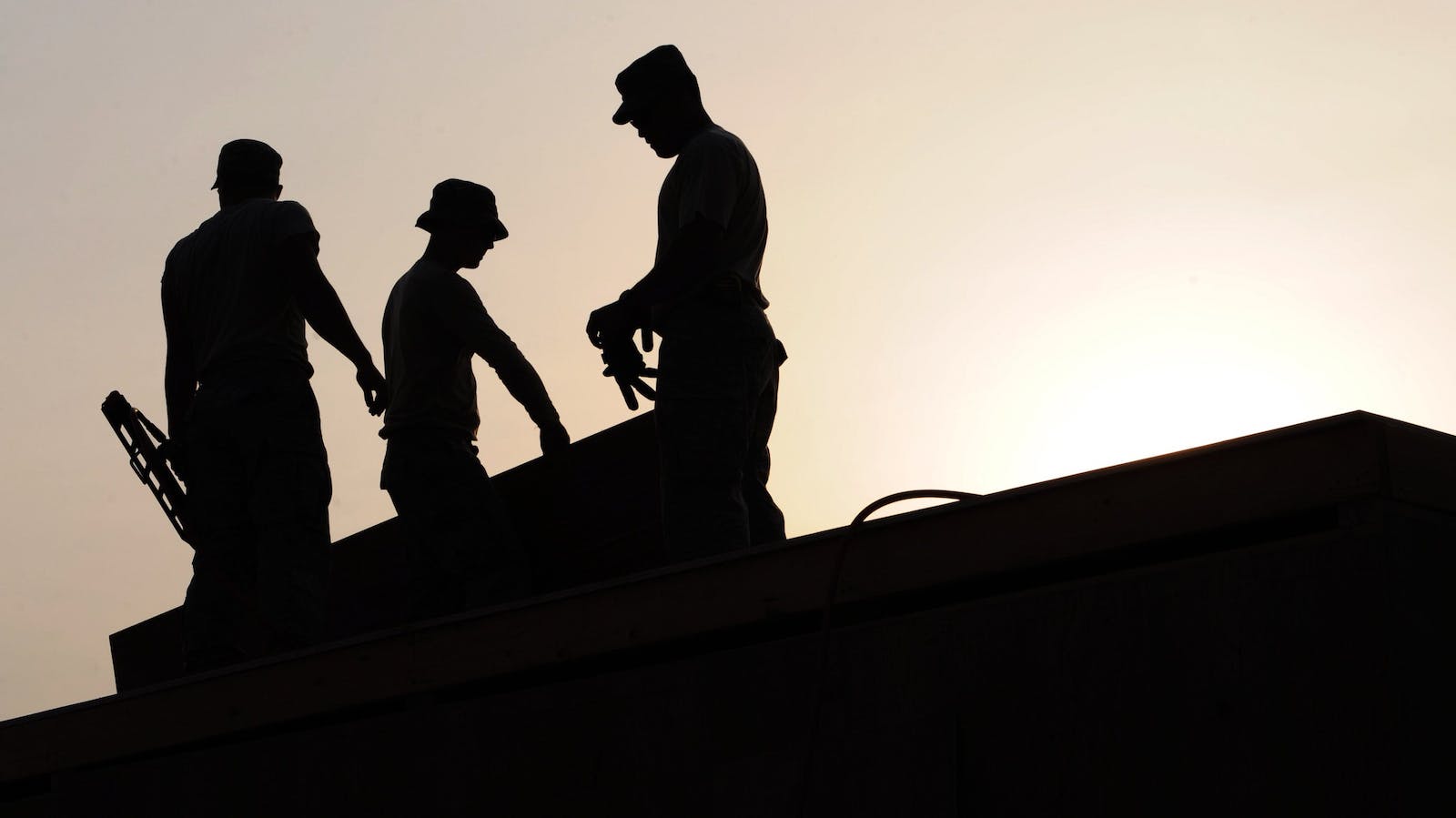 3 Silhouette of Men Under White Sky