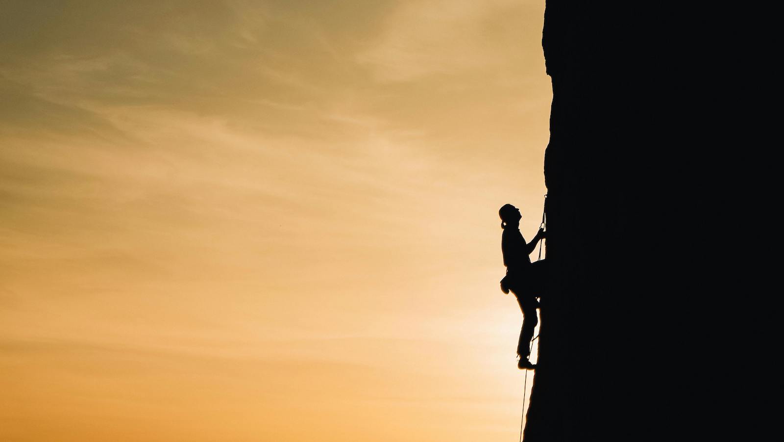 Person Rock Climbing