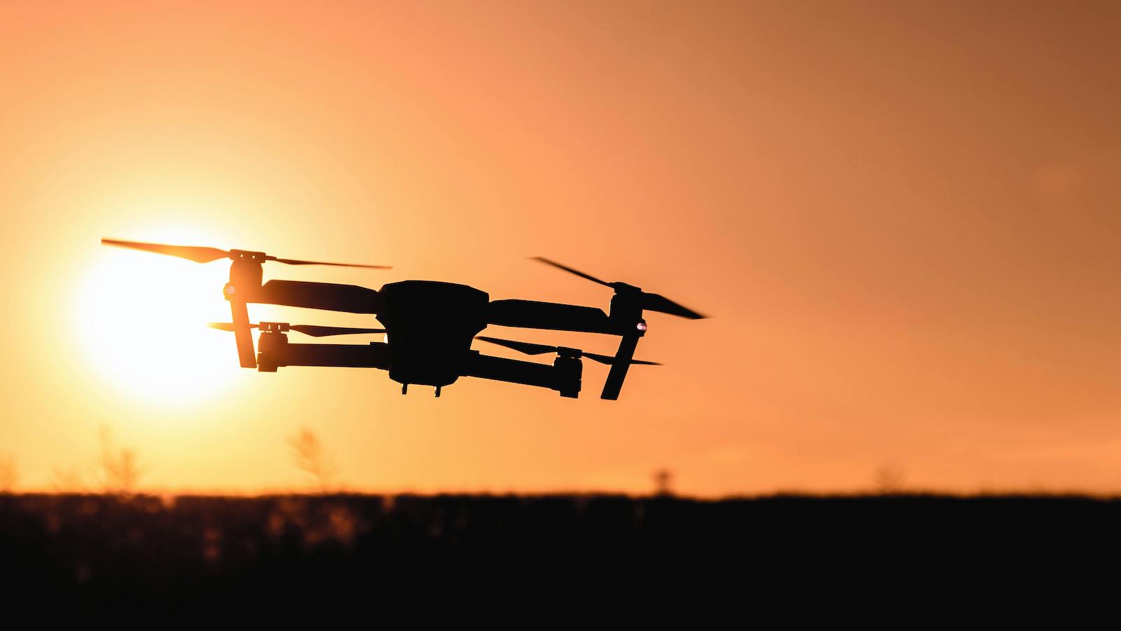 Silhouette of a drone at dusk