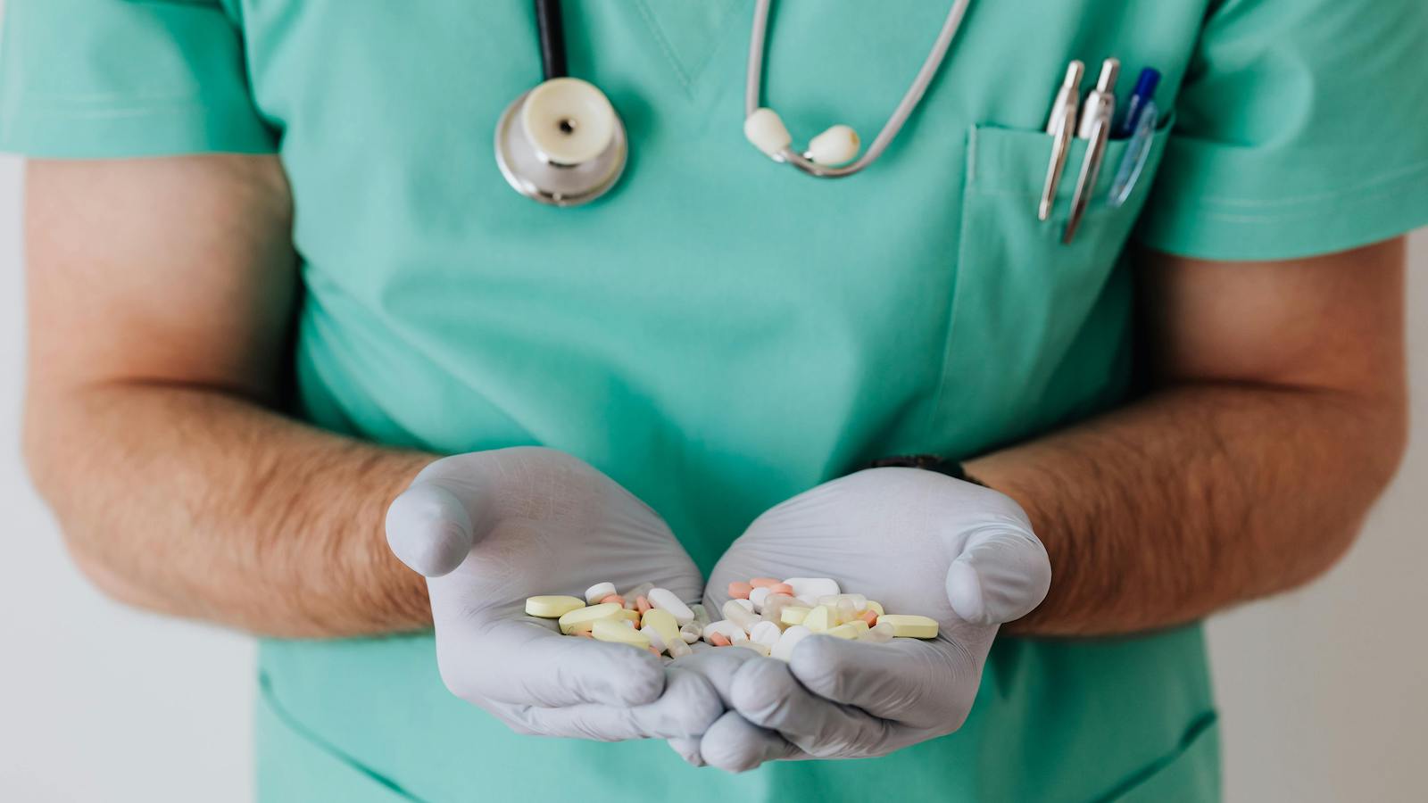 Doctor holding pills