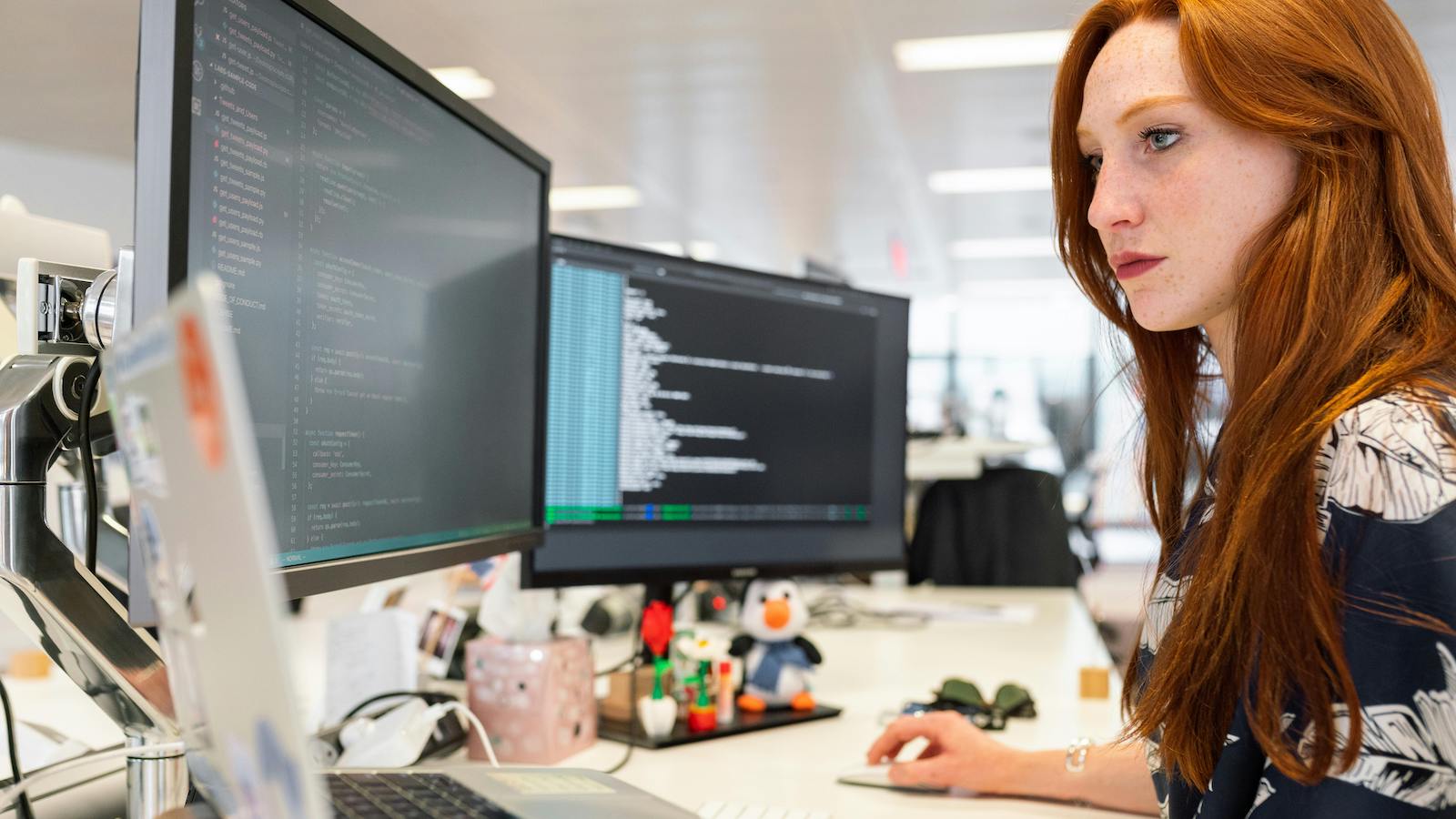 Woman coding on computer