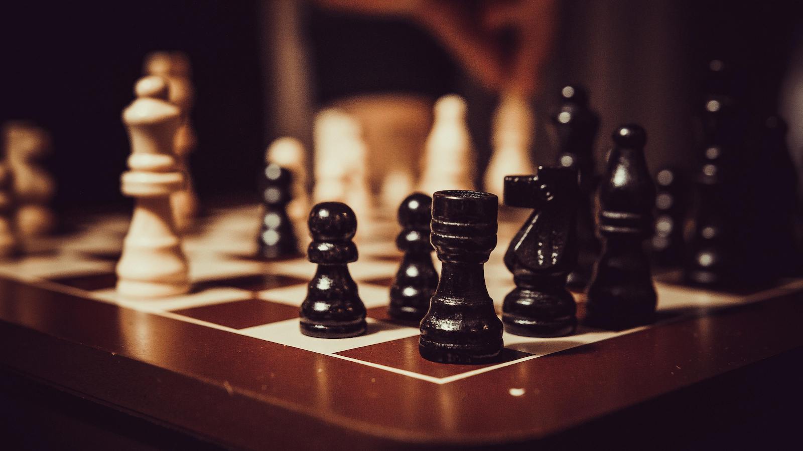 Black and White Chess Pieces on Chess Board