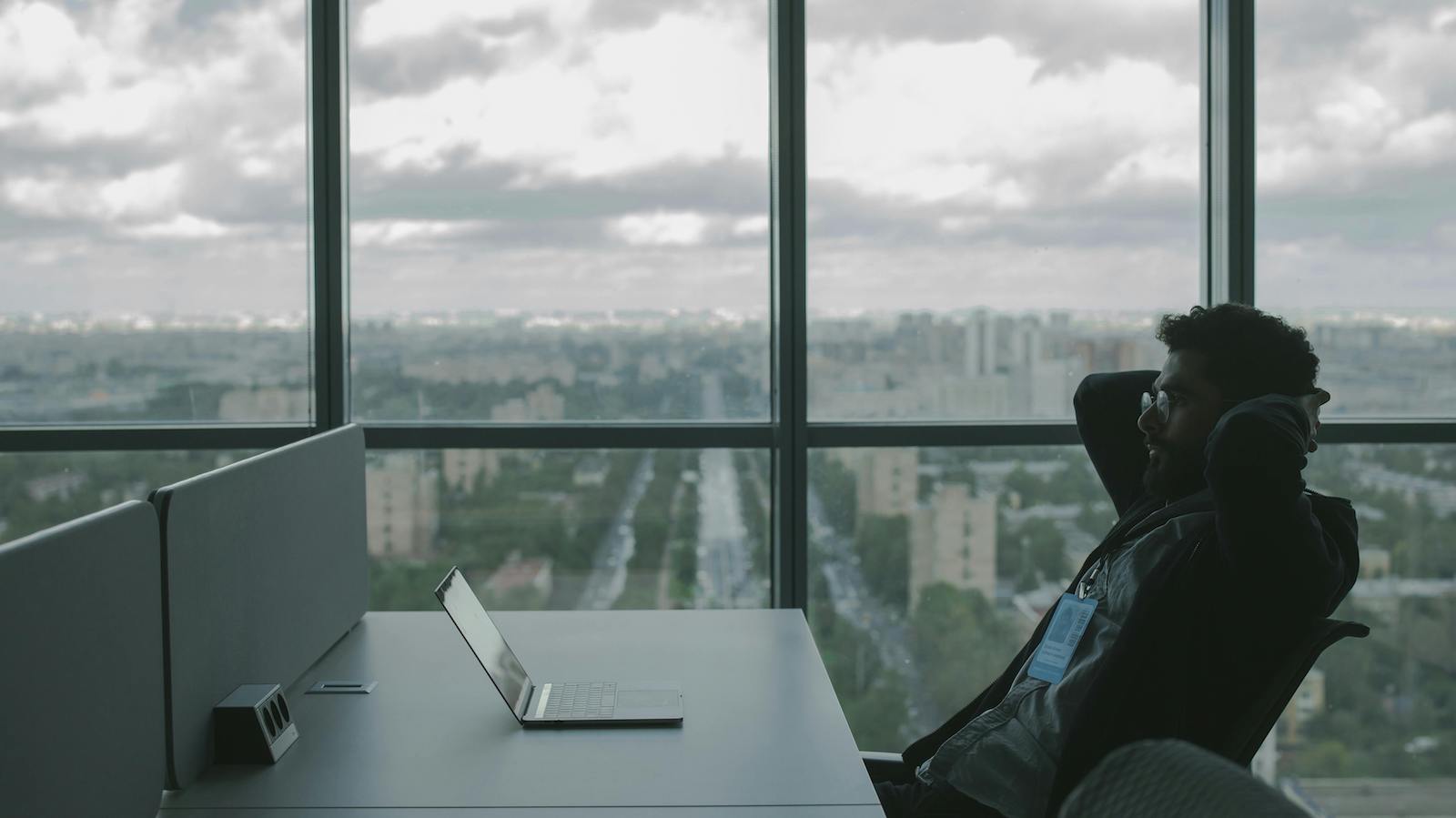 Man Reclining and Looking at his Laptop