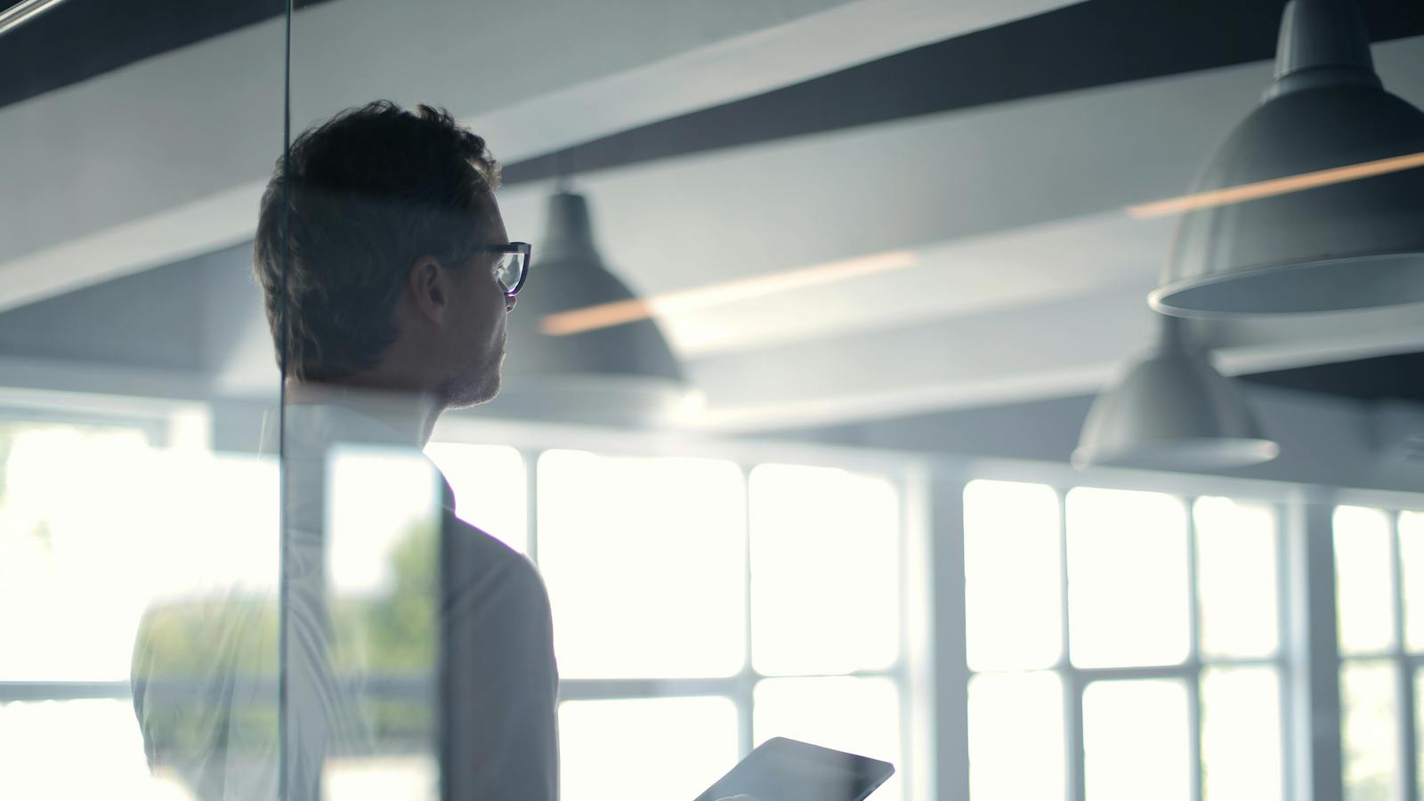 Man with tablet giving presentation in office