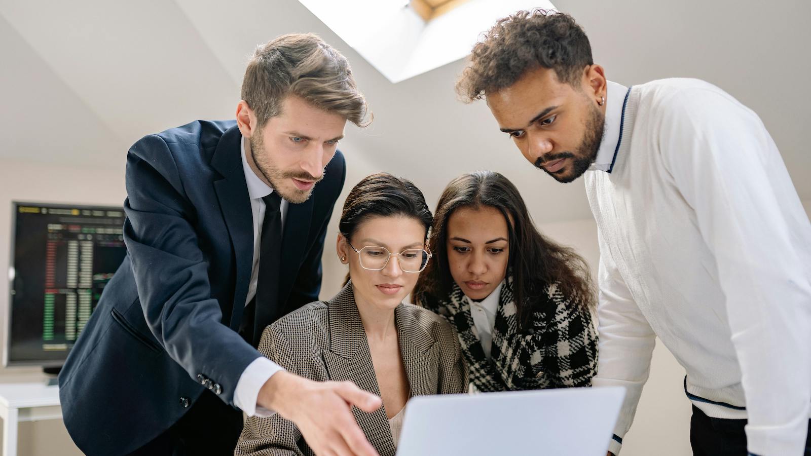 Women and Men Working over Laptop