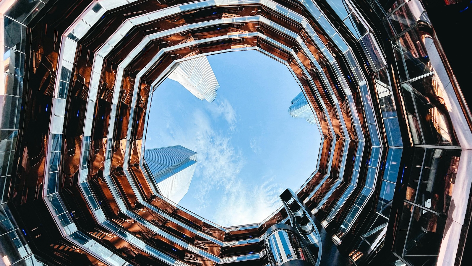 View from below looking up of the sky in an office building