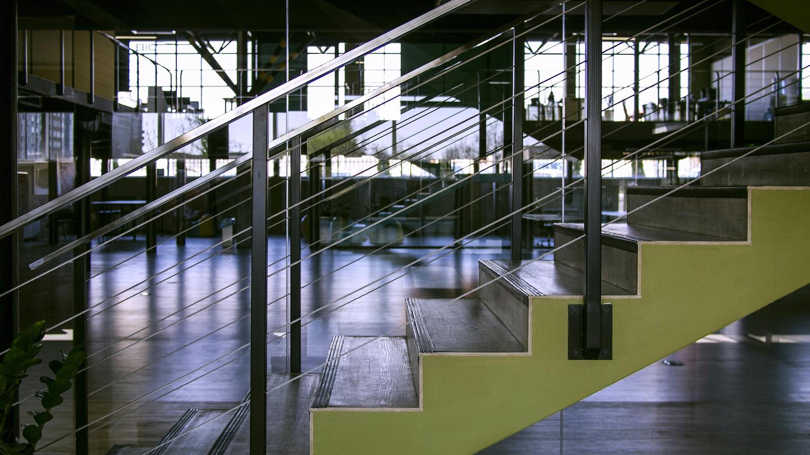 Gray Steel Handrails on Green Stairs