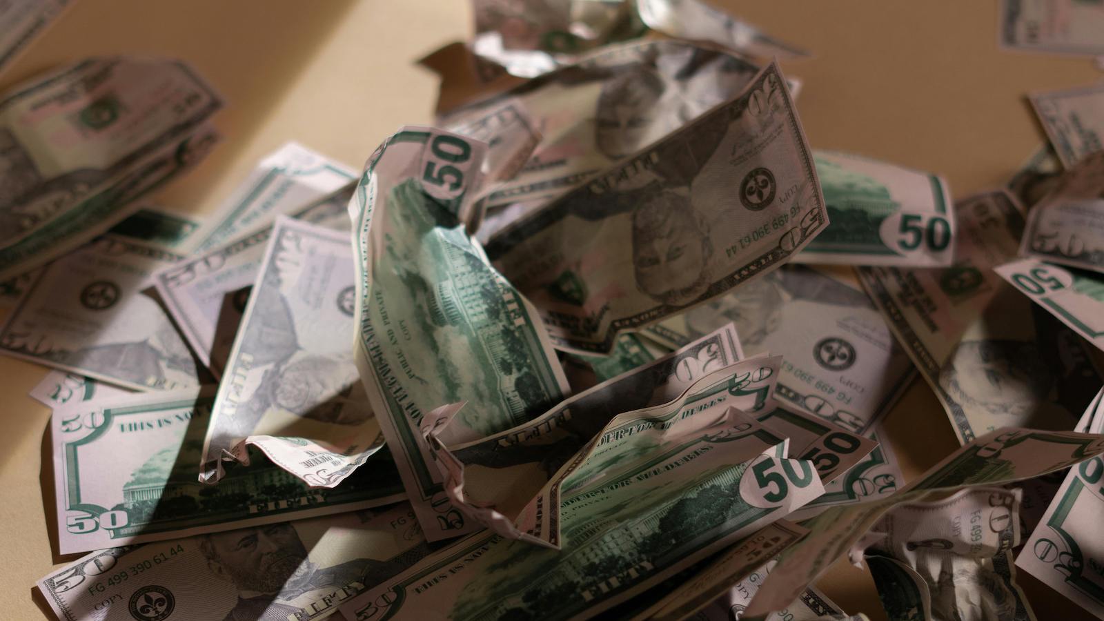 Us Dollar Bills Crumpled on the Floor