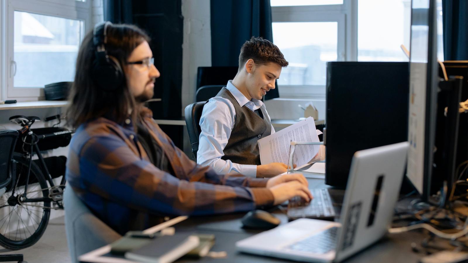 Men Sitting at a Desk