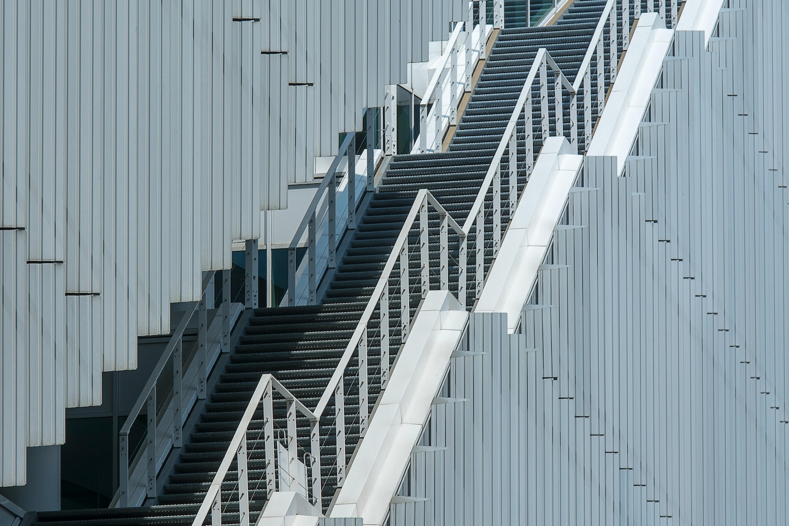 Long External Stairs in the Facade of the Building in greyscale