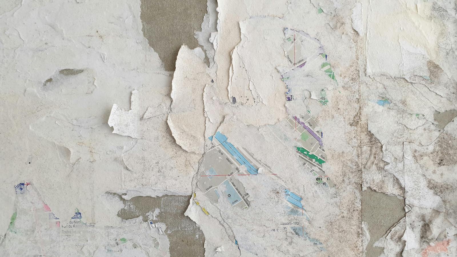 Concrete Wall with Peeled Off Paper and Paint