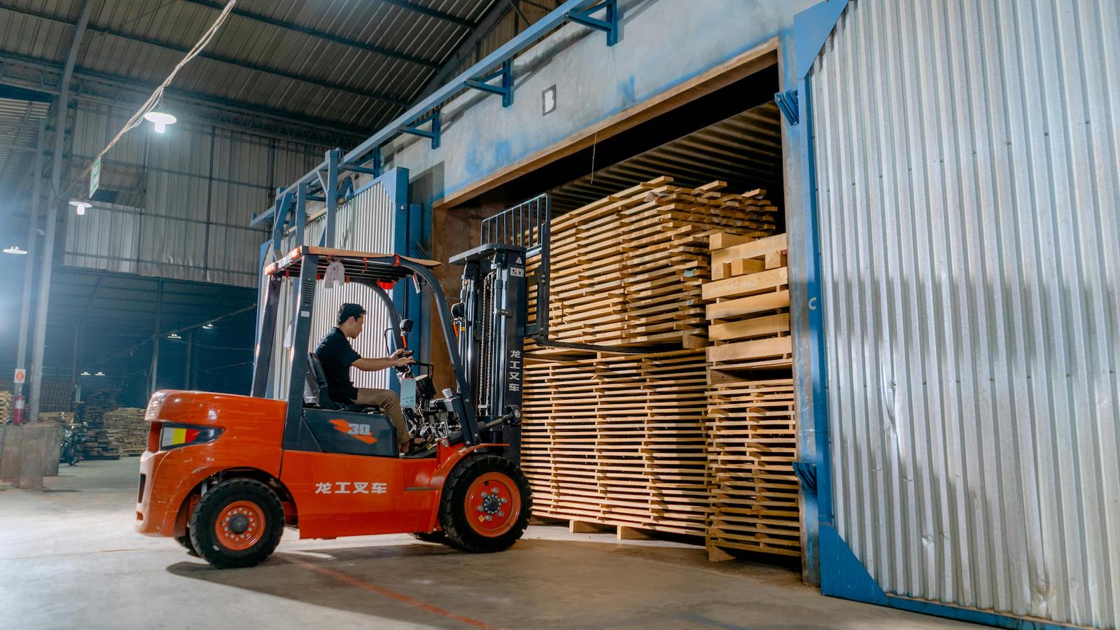 A Man Driving a Forklift