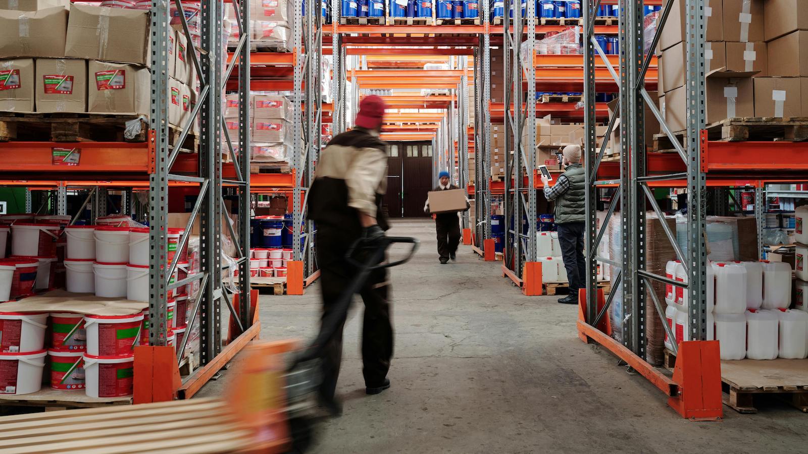 Photo of Men Working in a Warehouse