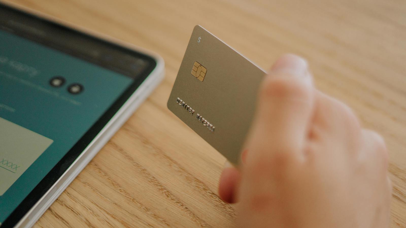 Close-Up Shot of a Person Holding a Credit Card