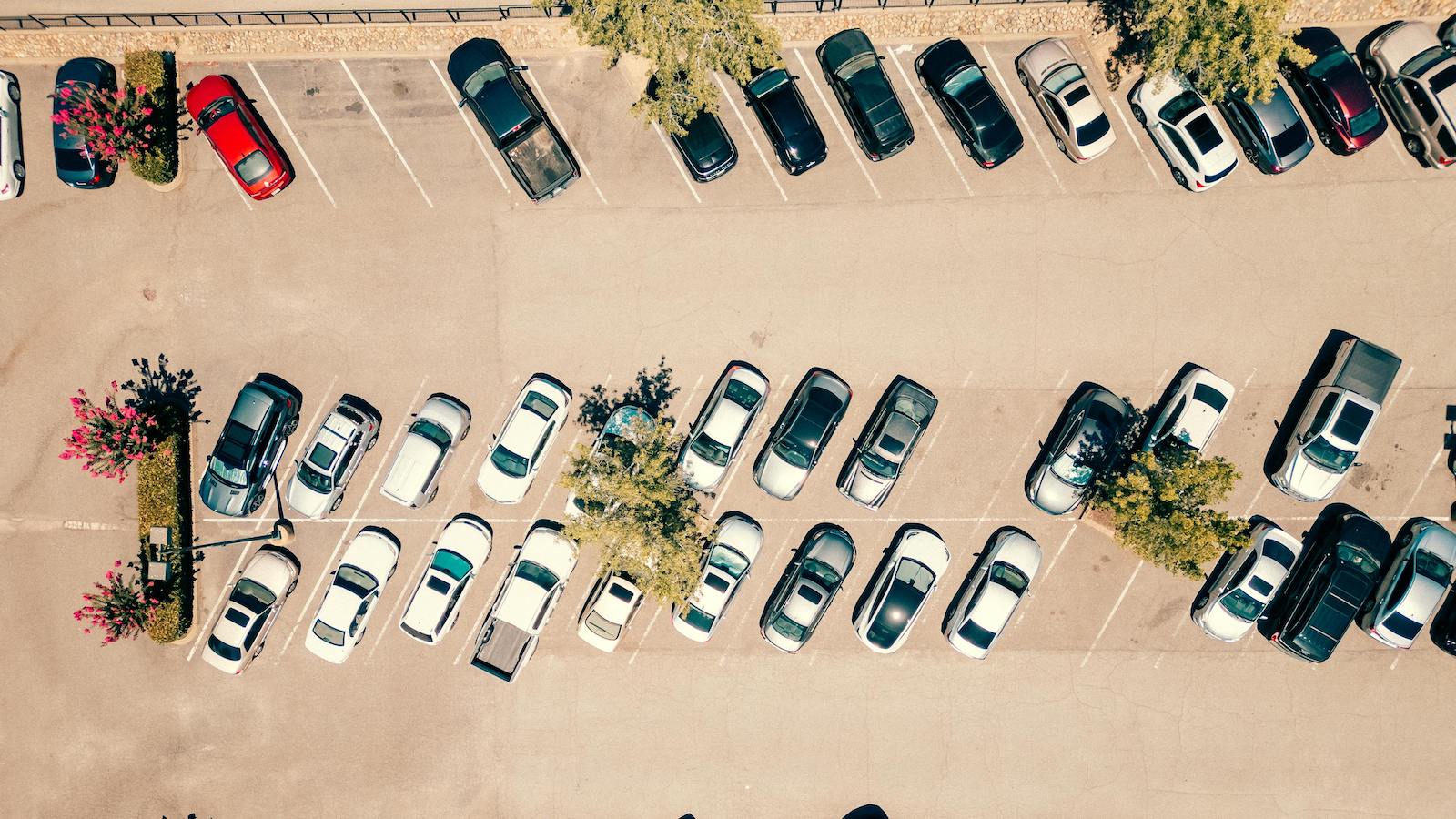 Aerial View of a Busy Parking Lot on Sunny Day
