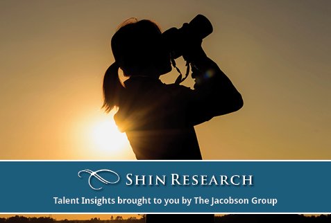 Woman looking at sky with binoculars